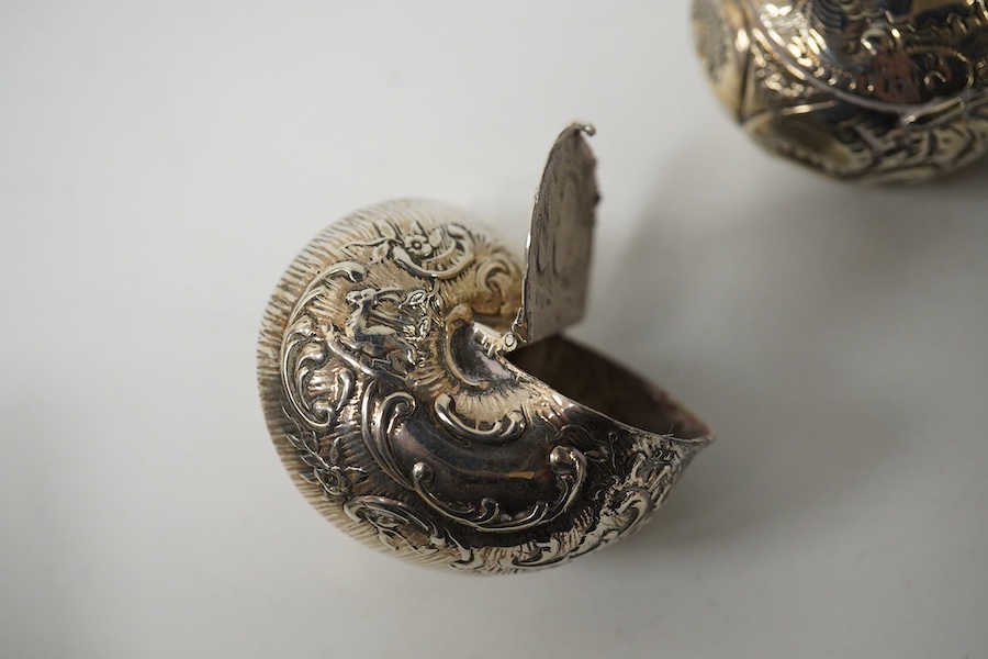 Three small silver boxes, including late Victorian modelled as a snail shell, import marks for London, 1898?, one modelled as a miniature cabinet, makers mark only and a late Victorian circular pill box. Condition - fair